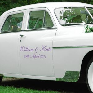 Personalised purple vinyl decal featuring names 'William & Kate' and a wedding date applied to the side door of a white vintage classic car.