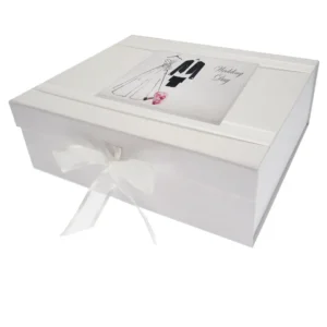 Large white 'Bride and Groom' wedding keepsake box featuring an illustration of a wedding dress and suit, handmade in England with a white organza ribbon tie.