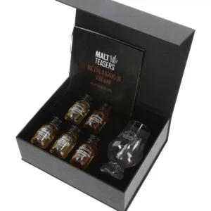 A luxury black gift box containing five miniature bottles of Scotch whisky, a tasting guide, and a Glencairn glass on a white background.