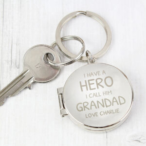 Personalised Photo Keyring: A high-quality metal keyring featuring a custom printed photo on one side and the engraved words "I Have A Hero, I Call Him Daddy" on the other. Shown with a secure attachment for daily use.