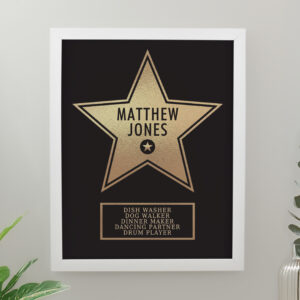 Personalised Hollywood Star Frame: A custom gold star print in a modern white frame. The star features the name "Matthew Jones" and a list of humorous roles including "Dish Washer" and "Dancing Partner."