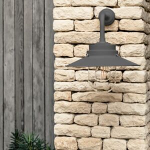 HMS Belfast inspired Carbon deck light mounted on a light stone wall.