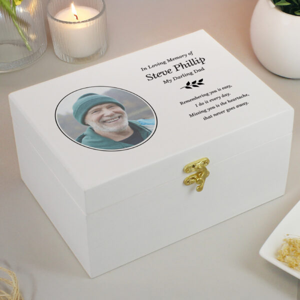 Personalised white wooden photo upload memorial keepsake box reading In Loving Memory of Steve Phillip My Darling Dad beside a lit candle.